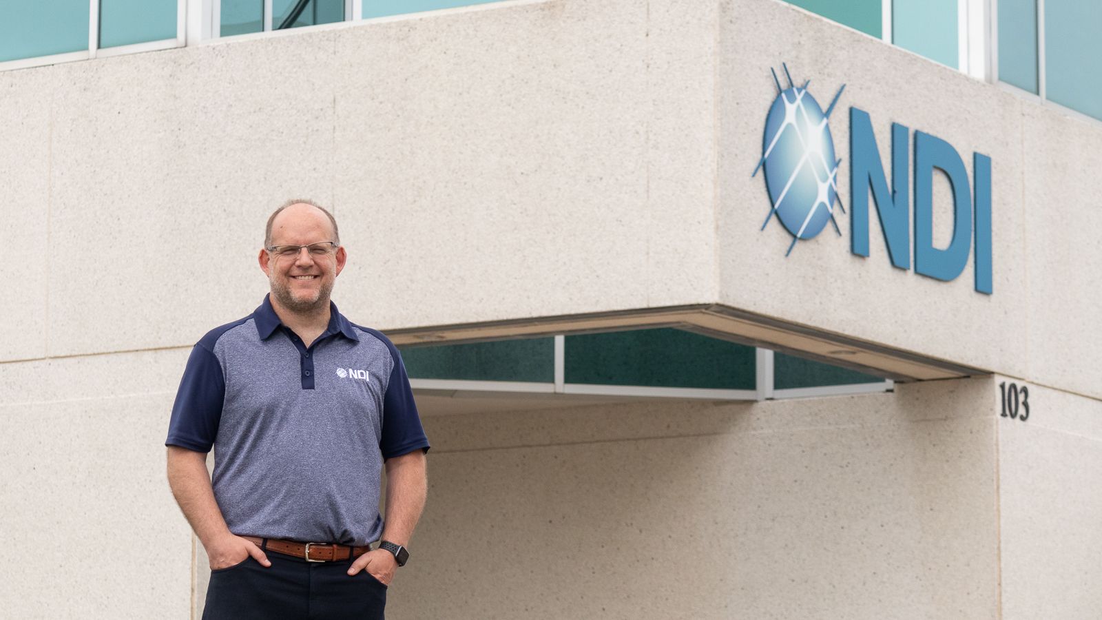David Rath, President of NDI, standing in front of the company's headquarters in Waterloo, Ontario.