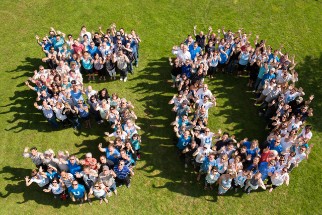 Aerial photo of people that spell out "50"