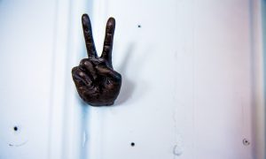 Statue of a hand in a peace sign