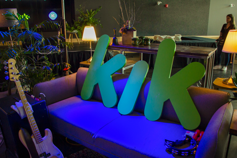 Green "Kik" letters on a couch